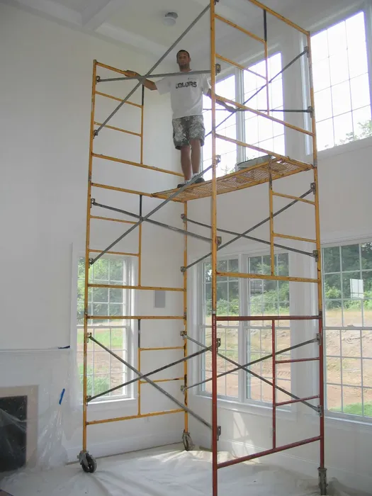 TCM Finishes professional painting crew on scaffolding in Downingtown PA since 2006