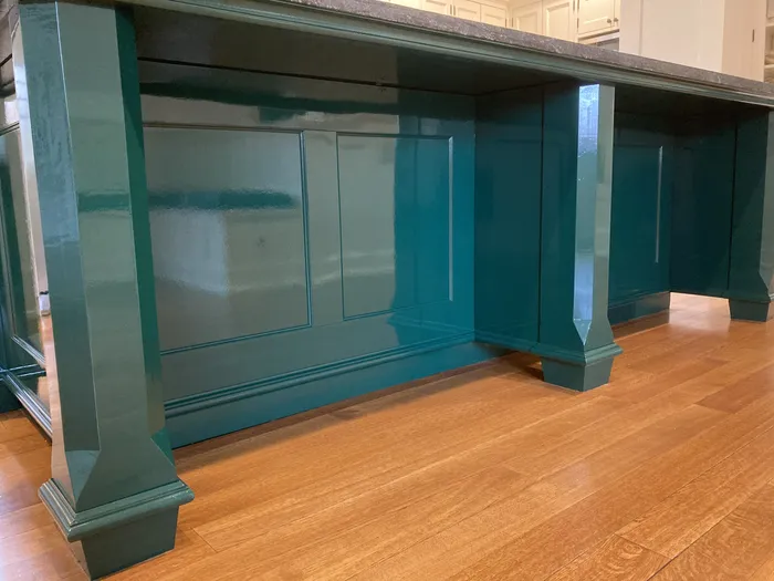 High-gloss teal painted kitchen island refinished by TCM Finishes in Chester County PA
