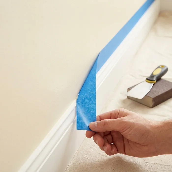 Precision masking and taping for sharp paint lines on interior trim