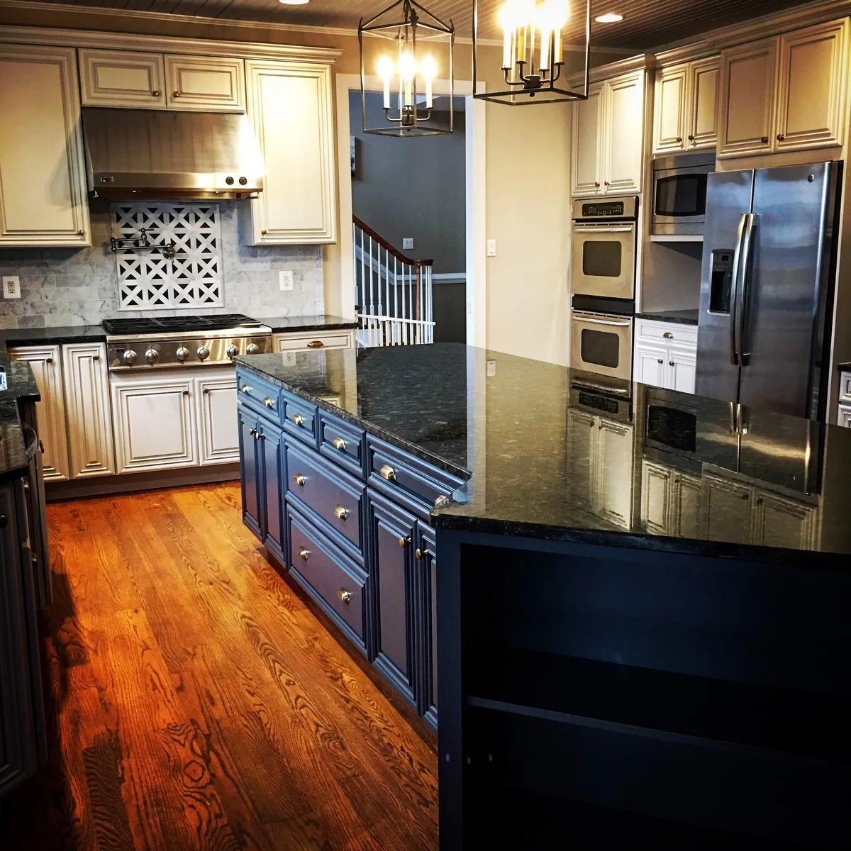 Two-tone kitchen cabinet refinishing with navy island and cream uppers, Malvern, PA