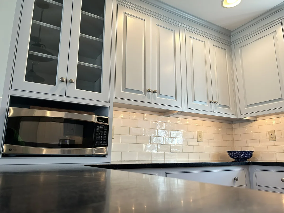 Refinished light gray kitchen cabinets with subway tile backsplash, West Chester, PA