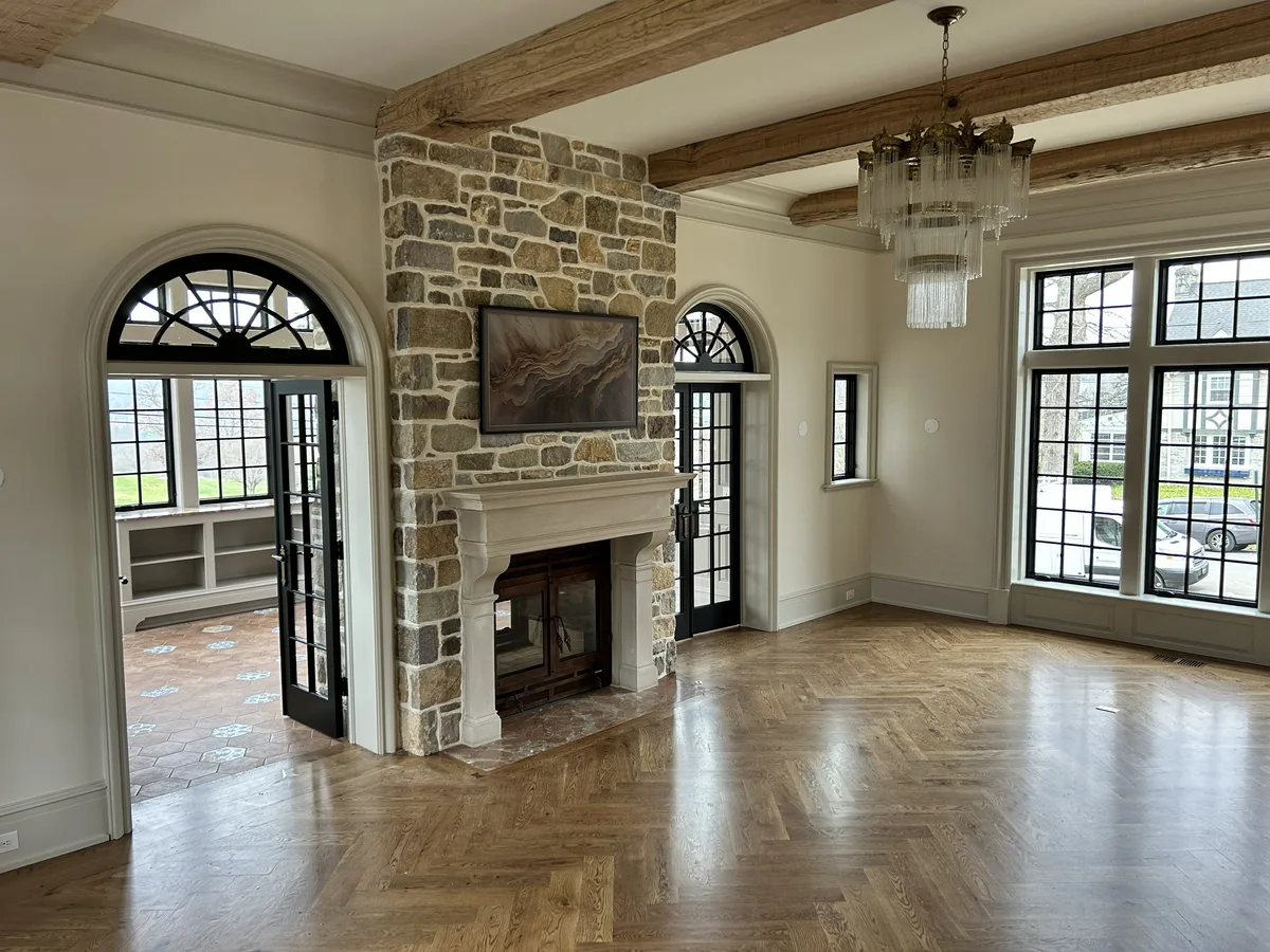 Freshly painted interior with stone fireplace and exposed wood beams, West Chester, PA